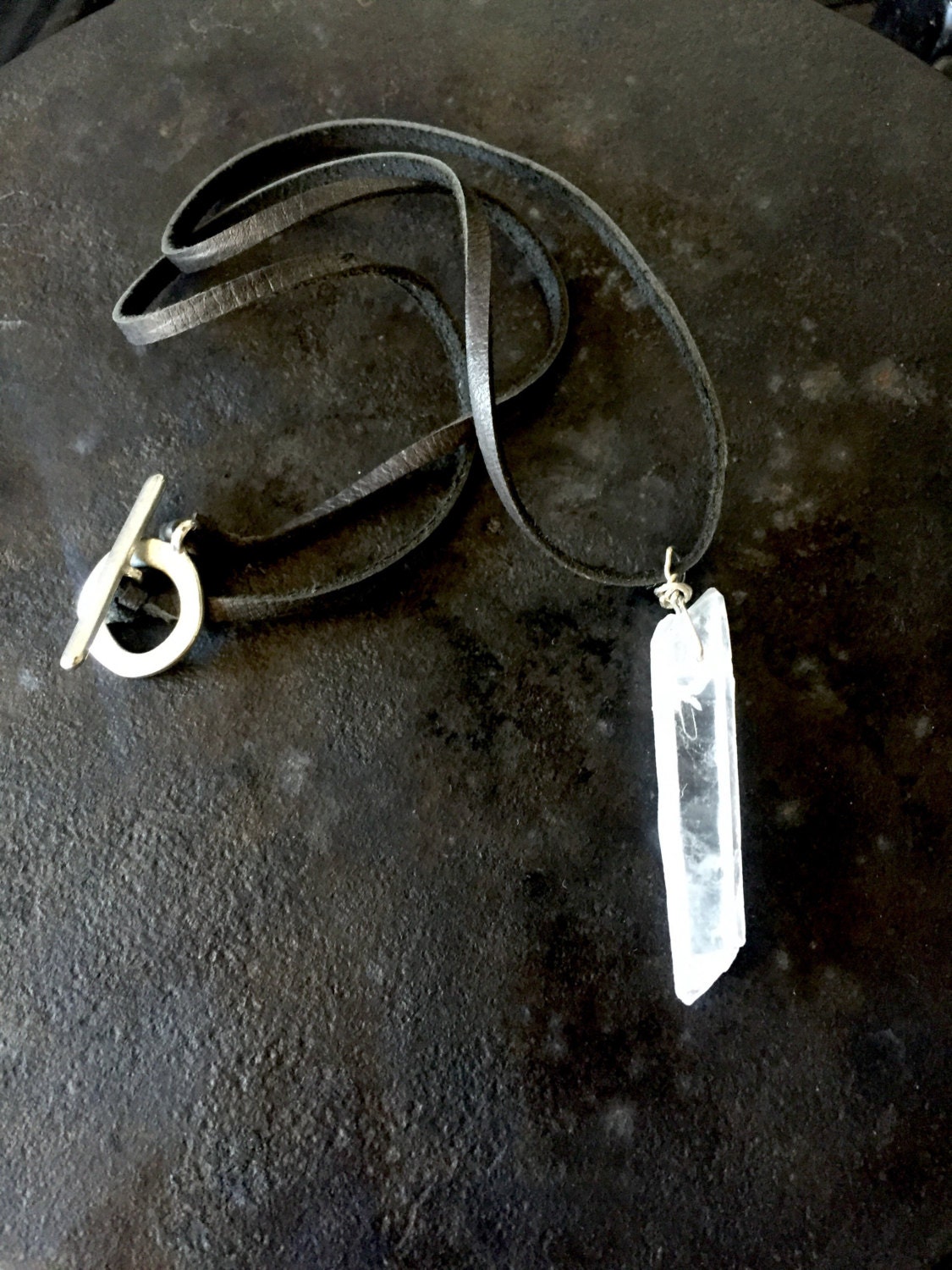 Mens quartz crystal necklace on a black deerskin leather cord
