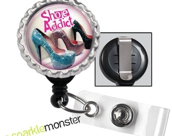 Shoe Addict - black ID badge reel with silver bottle cap, high heels, cute quote