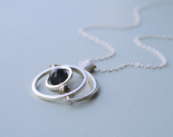 the Saturn Gryoscope necklace - Iolite and pyrite