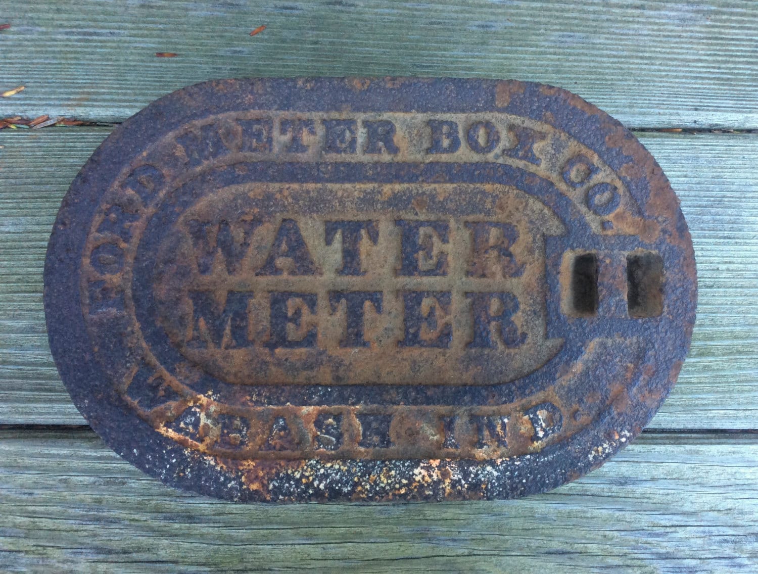 Vintage cast iron water meter cover industrial trivet