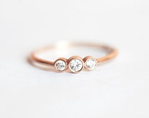 Delicate bezel set engagement ring