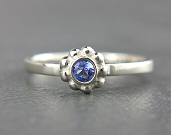 Tanzanite and aquamarine engagement rings