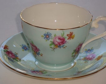 Antique Aynsley gold fleur de lis tea cup and saucer set made