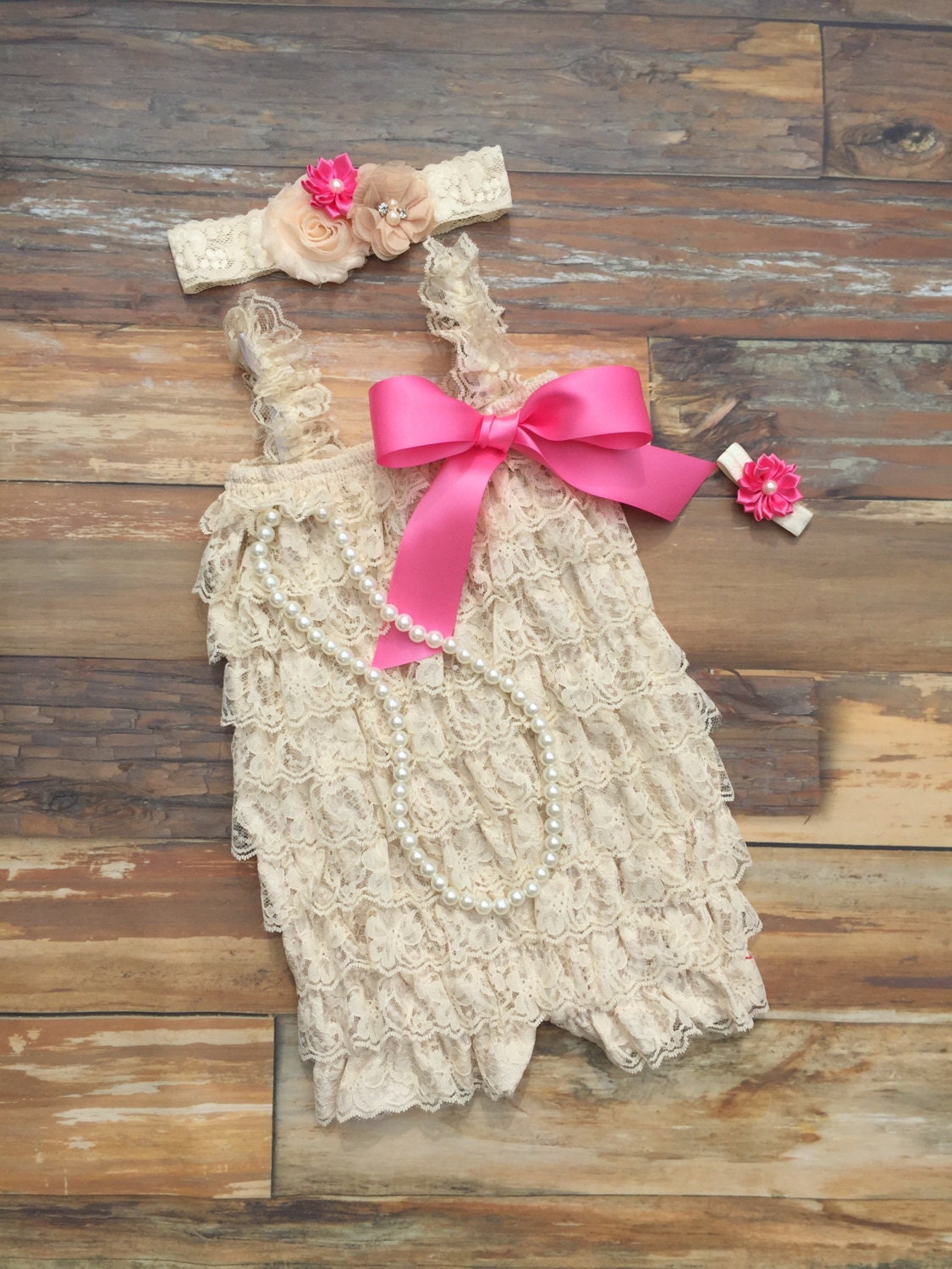 Baby girl first birthday outfit. Cream lace romper. Pink