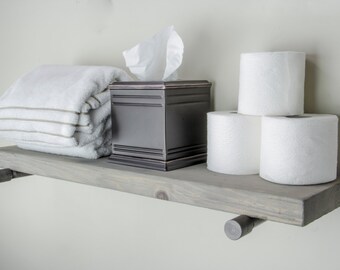 bathroom with floating shelves