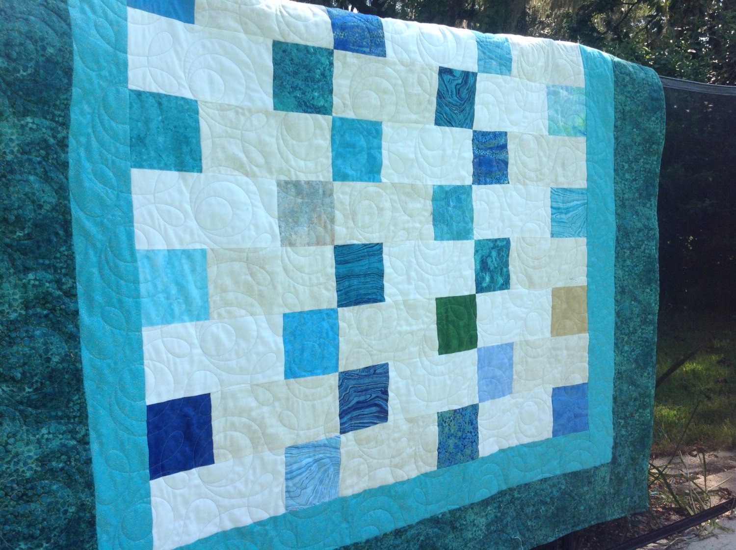 pieced-blue-and-cream-quilt