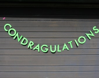 CONDRAGULATIONS congratulations RuPaul's Drag Race inspired letter banner - paper garland in neon green