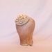 Handmade champagne coloured cord fascinator hat, decorated with handmade ribbon roses