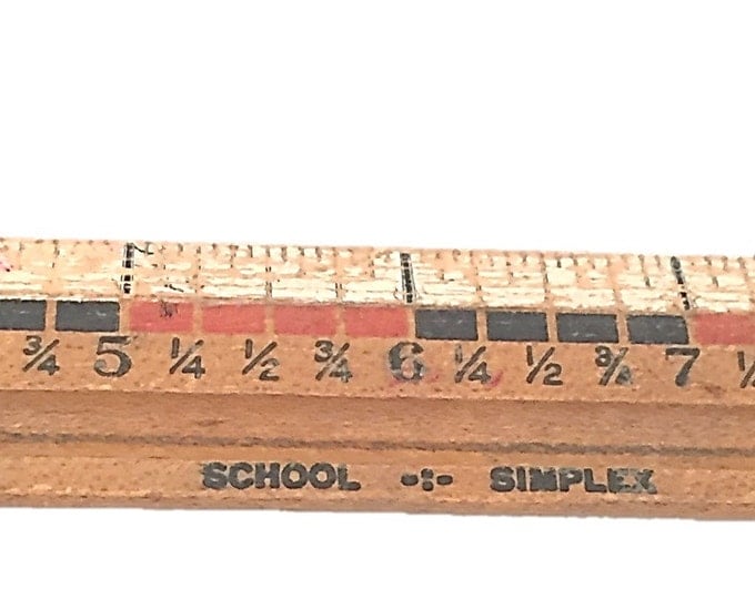 Vintage 12 inch School Simplex ruler. Useful ruler with inches - fractions and a protractor be on the reverse. Made in the USA.