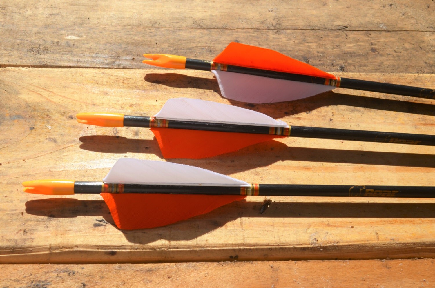 Archery arrows 3 vintage Bear fiberglass arrows. black with