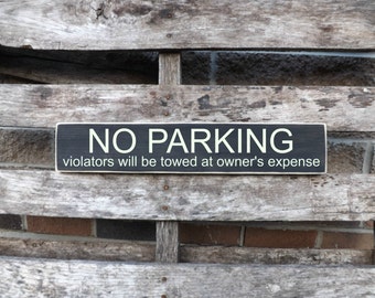 No Parking violators will be towed at owner's expense, Parking signs