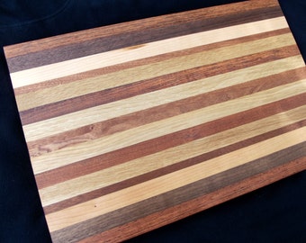 Butcher Block Cutting Board with three or more species. Each one is an original. 11"x17". Apx1" thick. Beautiful addition to any kitchen.