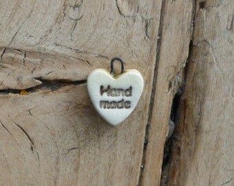 Heart shaped ceramic charms 'handmade'
