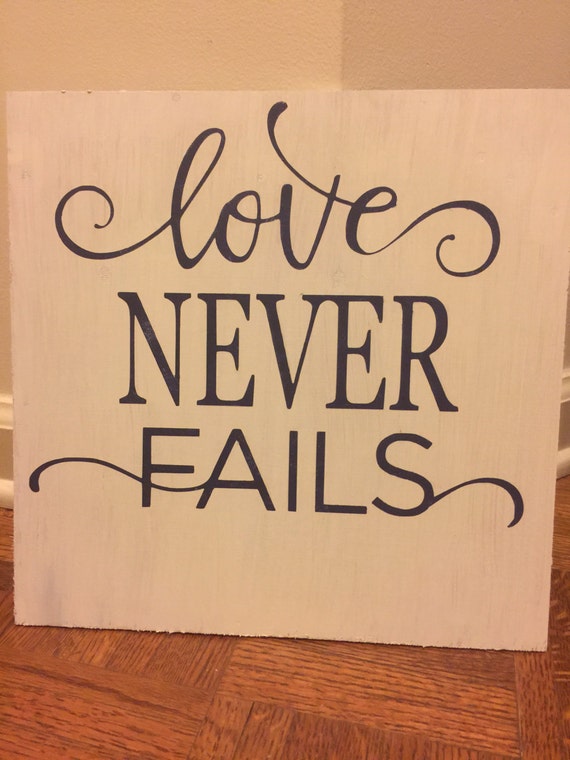 Love never fails hand painted sign