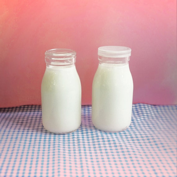 Items similar to 8 Glass Milk Bottles with Plastic Lids for parties on Etsy