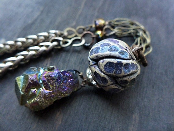 Luminous Night.  Rustic assemblage necklace with polymer clay and rainbow Aura pyrite crystal. 