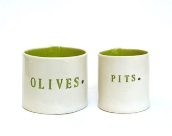 olives and pits  ...  hand built porcelain containers ...  chartreuse vessels