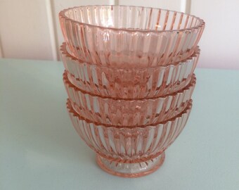 set of pink glass bowls