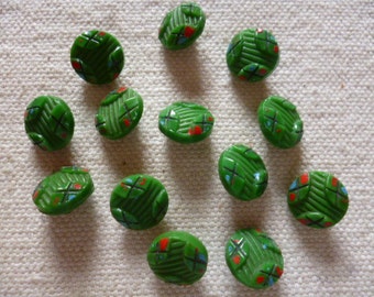 Vintage Buttons. 14 Green Glass Buttons from 1940's, with red black and blue highlights.