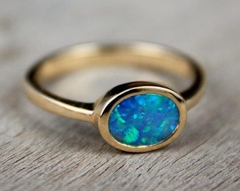 black opal engagement ring 14k solid gold east to west solitaire sku 7x5 e w - Black Opal Wedding Rings black opal engagement ring 14k solid gold east to west solitaire sku 7x5 e w - Black Opal Wedding Rings