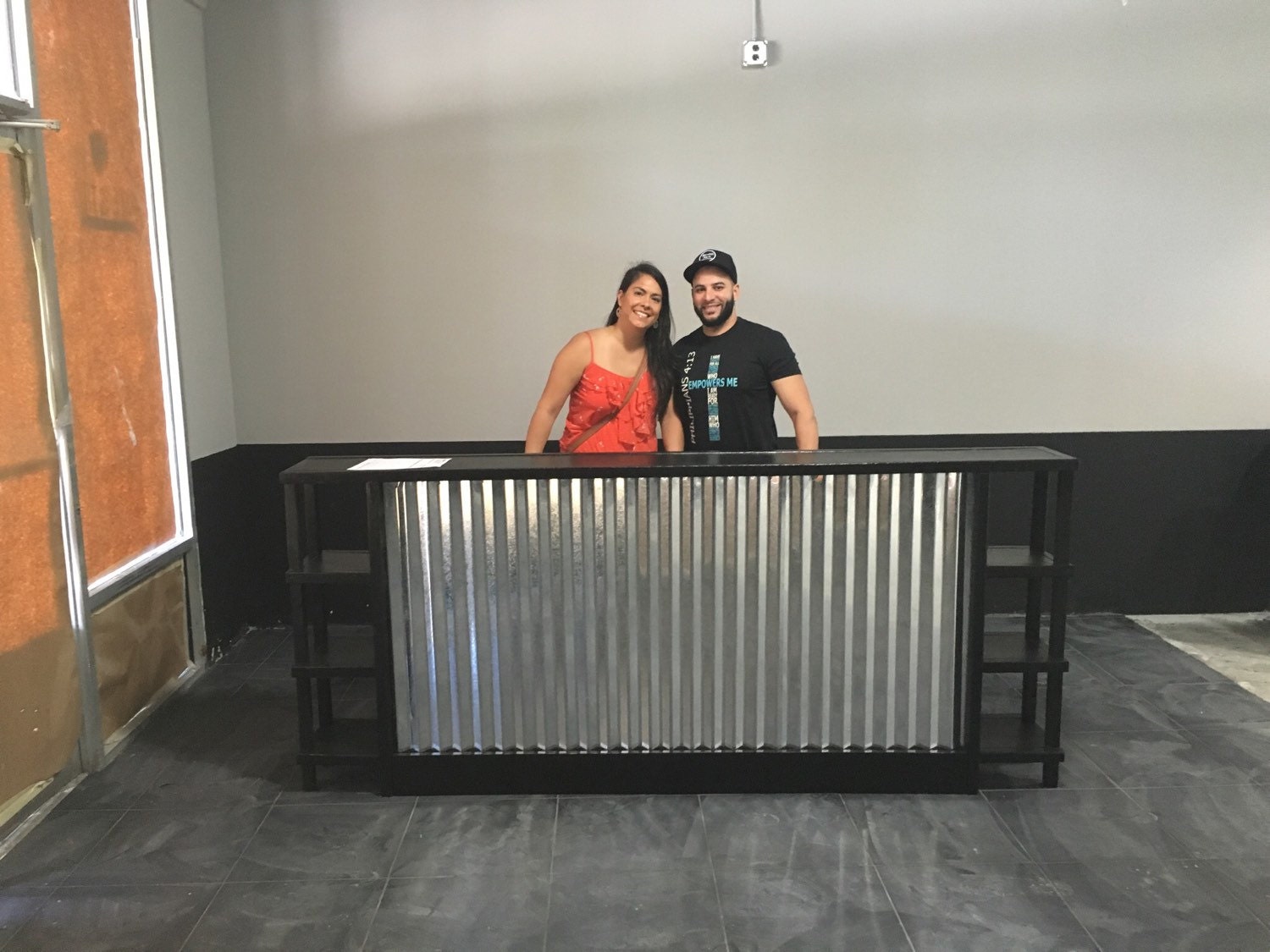 The Salon 8' corrugated metal sales counter or reception