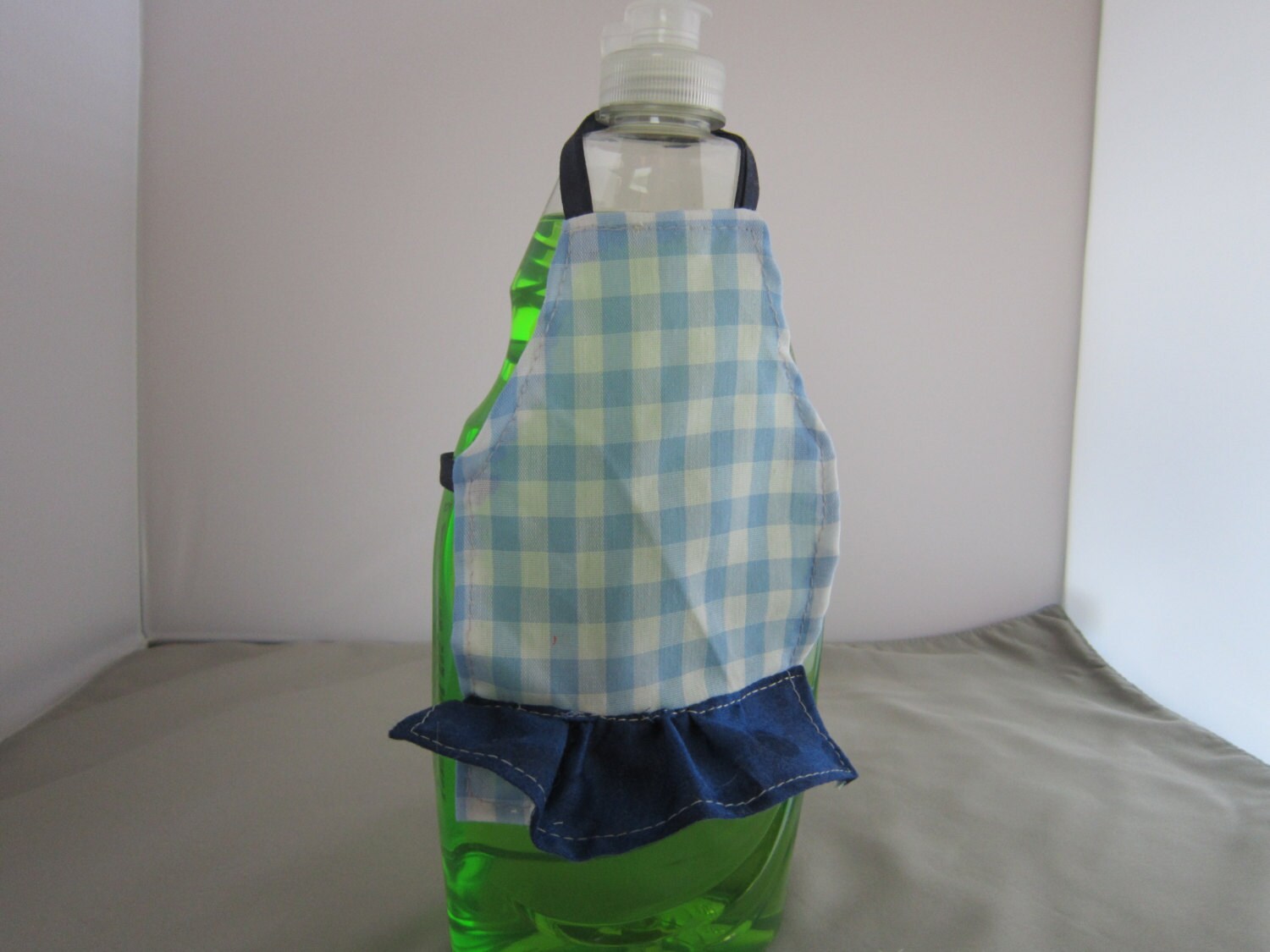 Apron for dish detergent bottle