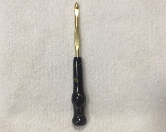Susan Bates Crochet Hook size J/10 6.00mm with hand turned handle in black and yellow acrylic.
