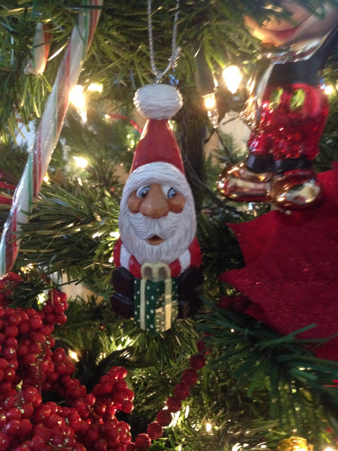 Sitting Santa Ornament With present