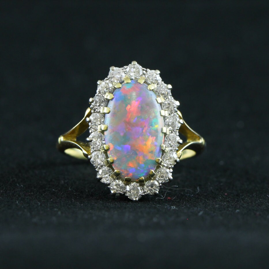 Opal and old European cut diamond halo ring Edwardian in 18