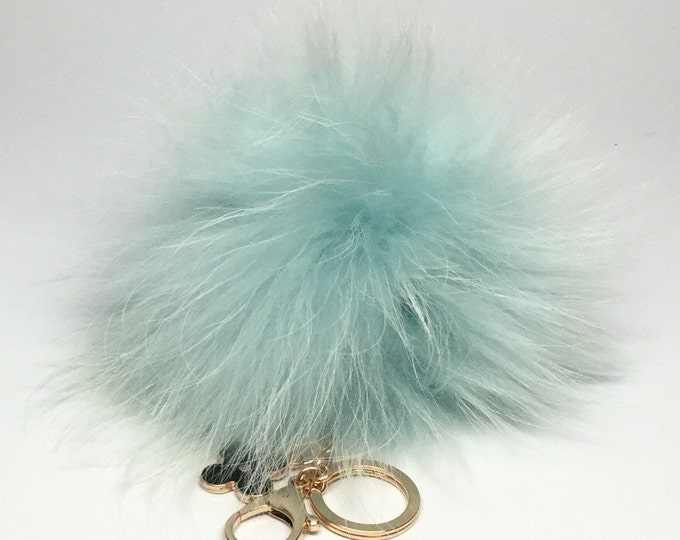 Very Light Blue with natural markings Raccoon Fur Pom Pom luxury bag pendant + black flower clover charm keychain