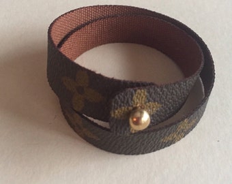 Double wrap bracelet upcycled from authenticLouis Vuitton canvas 15 " long, ball, screw post closure .approx 1/2" wide