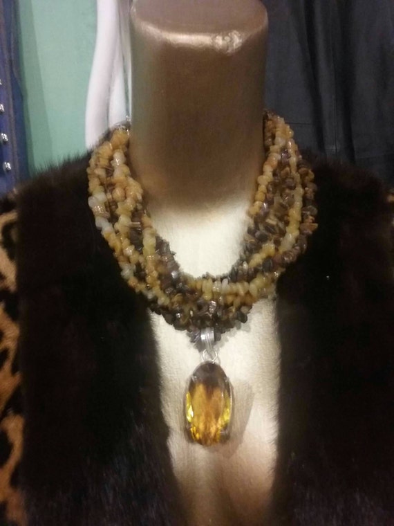 One of a kind tiger eye yellow jade twist with a 56 ct.