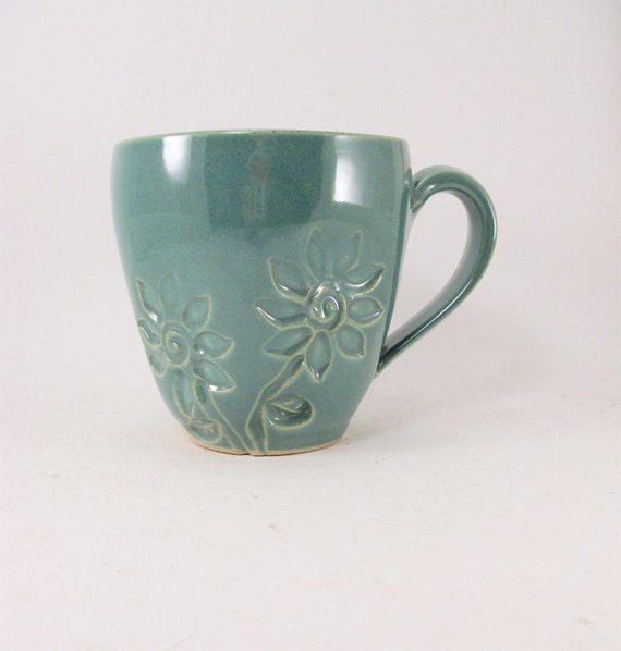 handmade green mug with stamped flowers