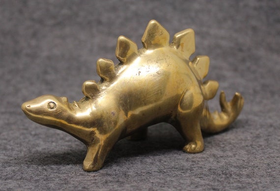 brass dinosaur figurine