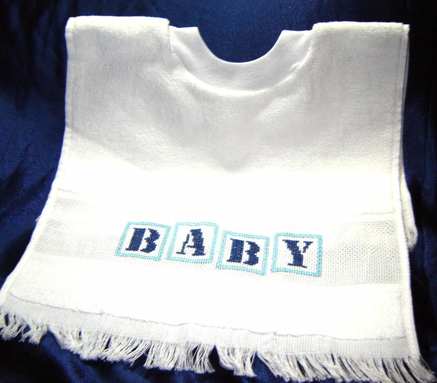White Baby Bib of a Counted Cross Stitch Bib in Shades of Blue