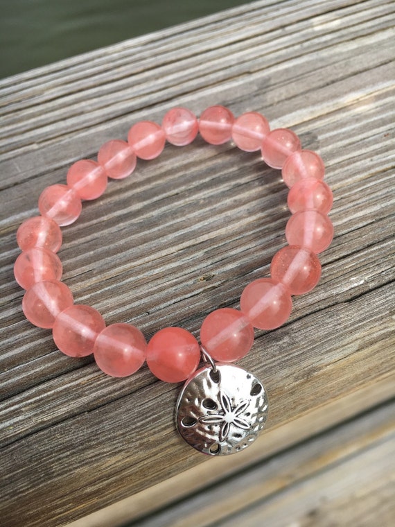 Genuine pink quartz stretch beaded bracelet. 10 mm beads.