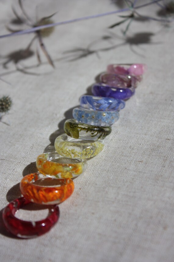 Rainbow rings. Ring epoxy resin. Geranium, kosmeya, forget-me, cornflower, spurge, delphinium
