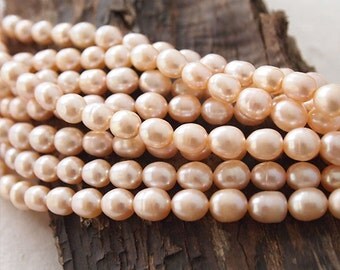 Strand Freshwater Pearls Peach Pink Rice Shape 8 x 7mm approximately 47 Pearls