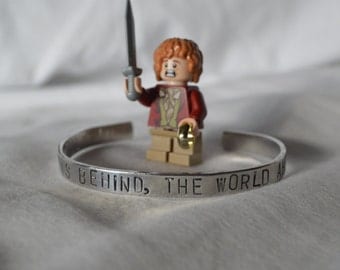 Bracelet: "Home is behind, the world ahead" from LOTR by Tolkien