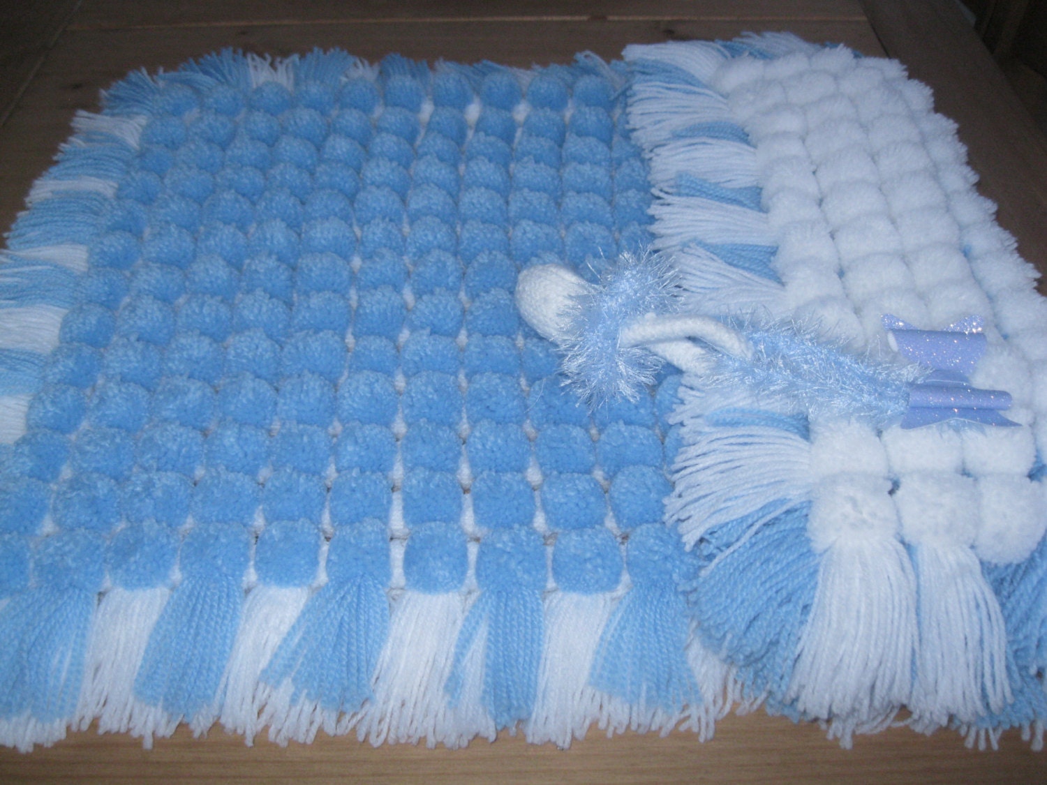 Blue pom pom pram blanket by CaPaCelebrations on Etsy
