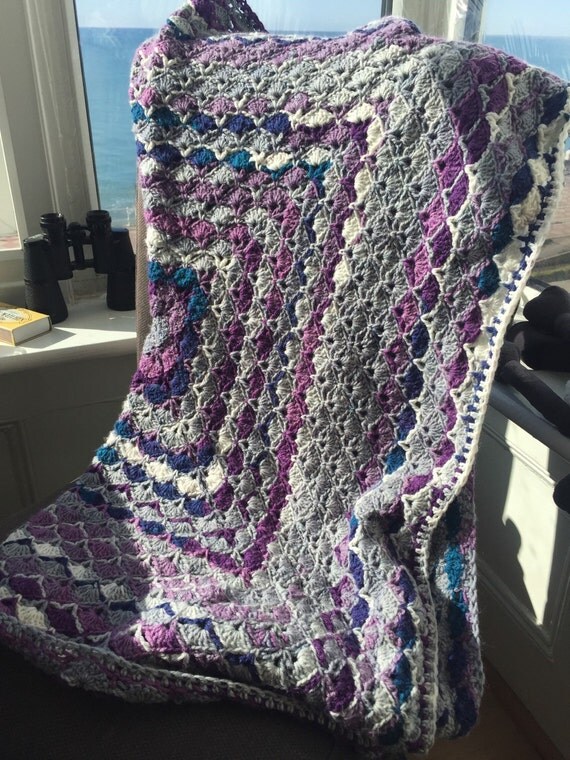 Soft purple and grey yarn crochet lap blanket. Granny square.