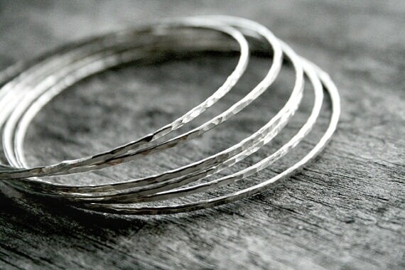 six textured round rings, stacked