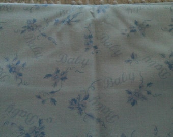 Childrens Novelty Fabric BABY in Script on Lt. Blue on Pink