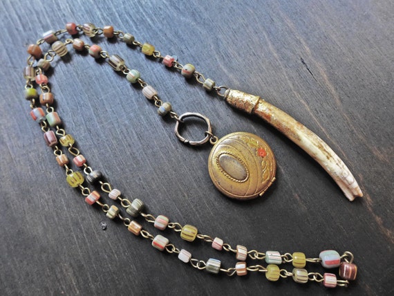 Pregnatress. Art lariat. Locket and tooth Victorian tribal assemblage necklace. 