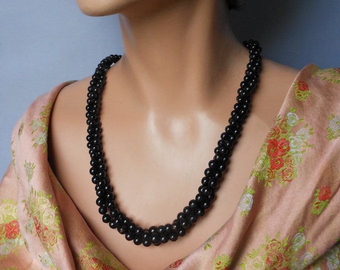 Black torsade necklace, 1960s black three strand faux pearl, twisted black cabochon clasp.