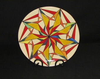 29cm Round platter mainly reds and yellows