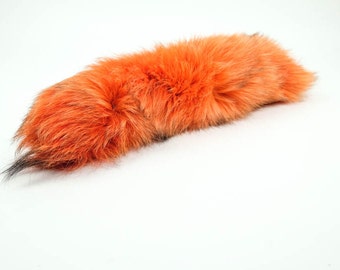 One premium dyed orange Fox tail : keychain optional