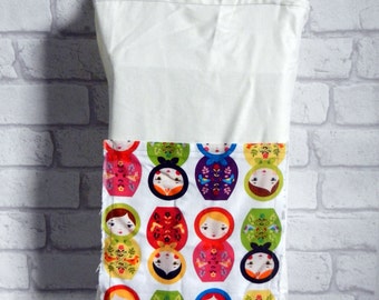 Russian nesting doll Matryoshka (Little Kukla) shopping tote. Double lined polycotton bag in natural white colour. Front pocket for notebook