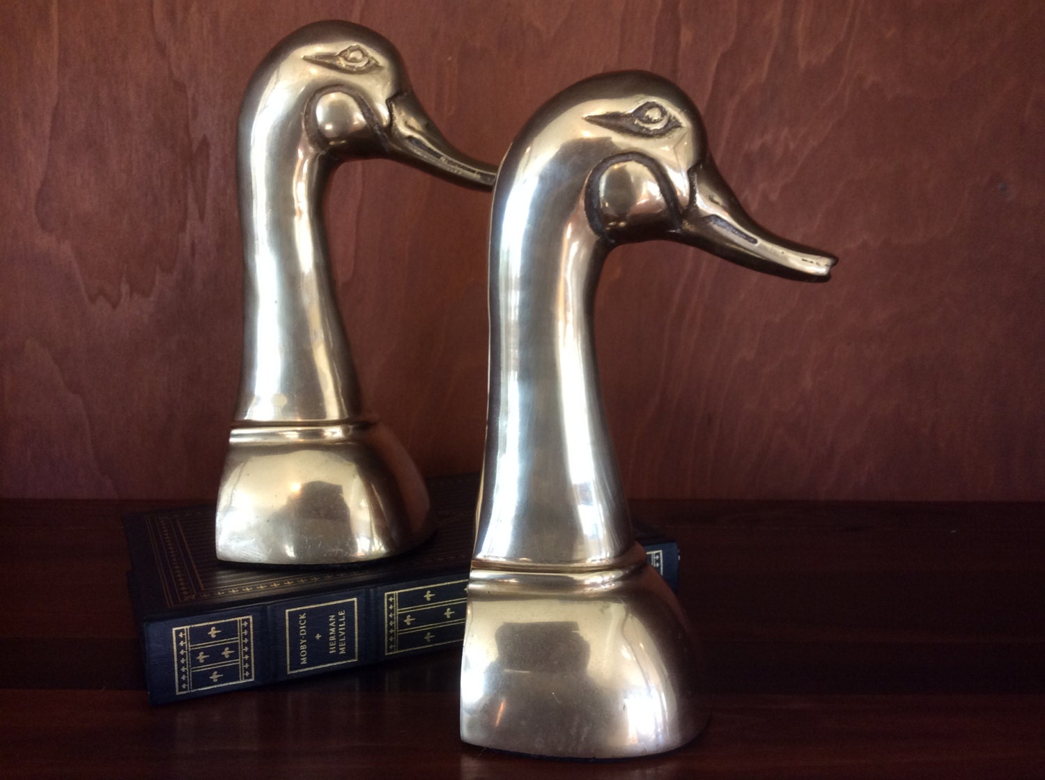 brass bookends marked with t