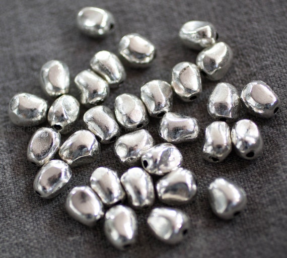 271-9285 PEWTER NUGGETS 1210mm. One bag of pewter zinc alloy